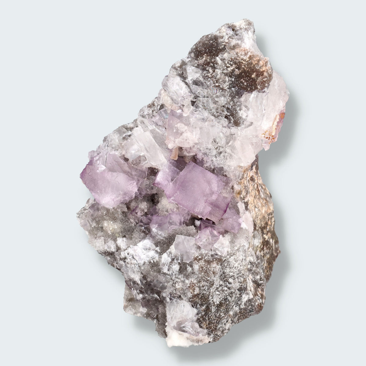 Violetter Fluorit aus Mexiko mit weissen und gelben Quarz Anlagerungen (327g)
