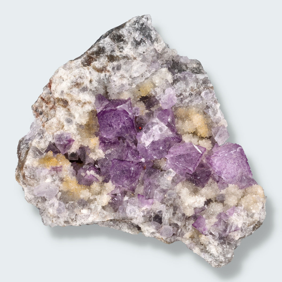 Violetter Fluorit aus Mexiko mit weissen und gelben Quarz Anlagerungen (121g)